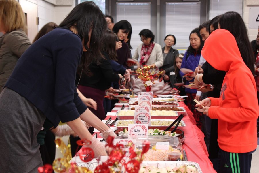 People getting food at the Lunar New Year Celebration.