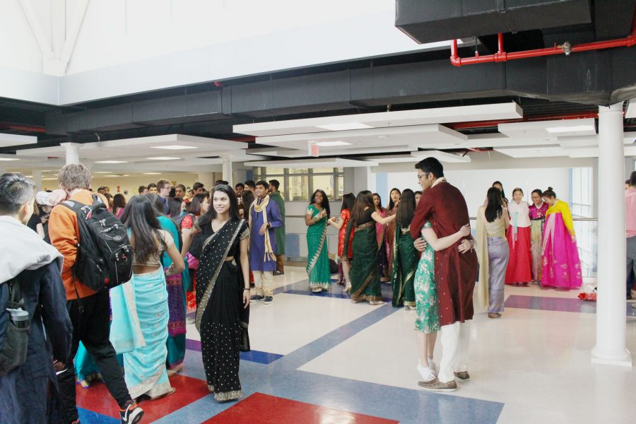 Students walk down the hall by the Freshman IBET commons on Red Day, in order to celebrate women’s rights.