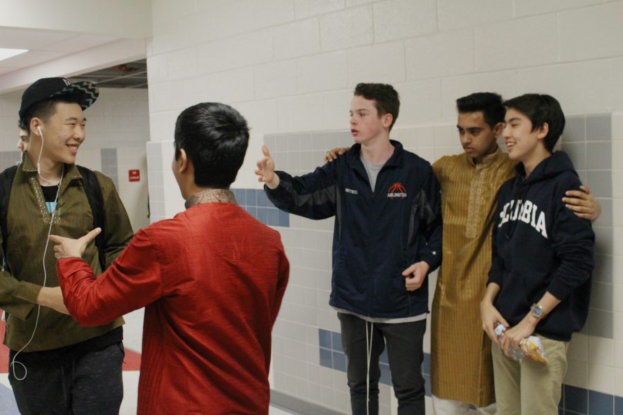 Several Freshmen try to organize a picture for International Day.