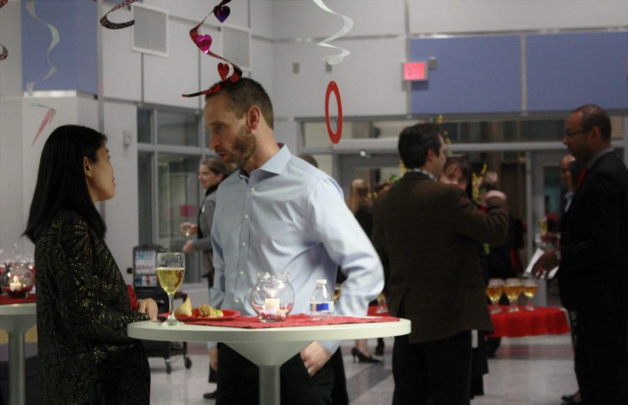 Counselor Sean Patrick Burke chats with a parent.