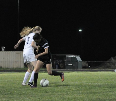 Senior Jodie Beaumont defends the ball against Falls Church.