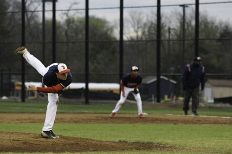 Freshman Andrew Arnold pitches the ball during a game on Apr. 7.