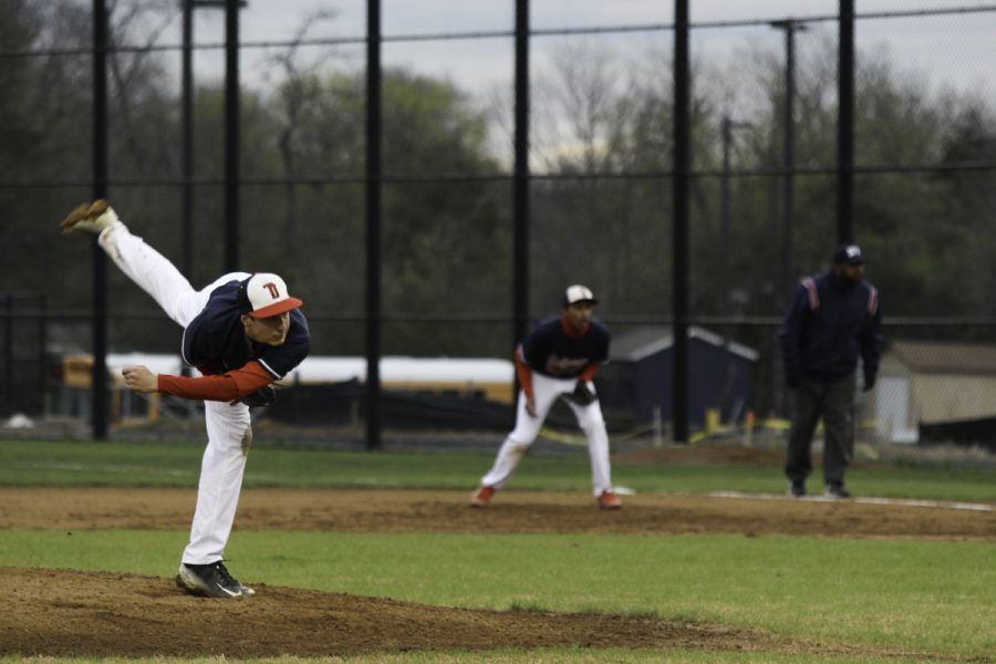 Freshman+Andrew+Arnold+pitches+the+ball+during+a+game+on+Apr.+7.