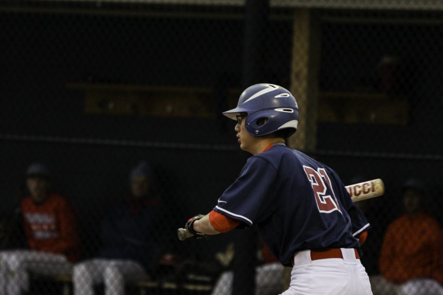 Freshman Patrick Zhang prepares to bat.