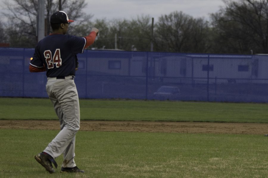 Sophomore Vikrant Magadi throws the ball to another player.