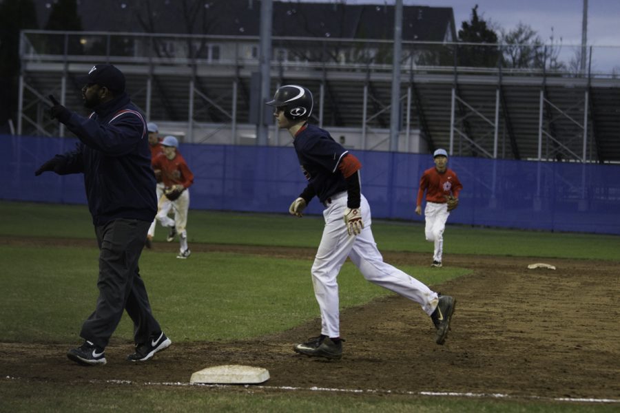 Freshman Ryan Berry jogs back to the dugout at the end of the inning.