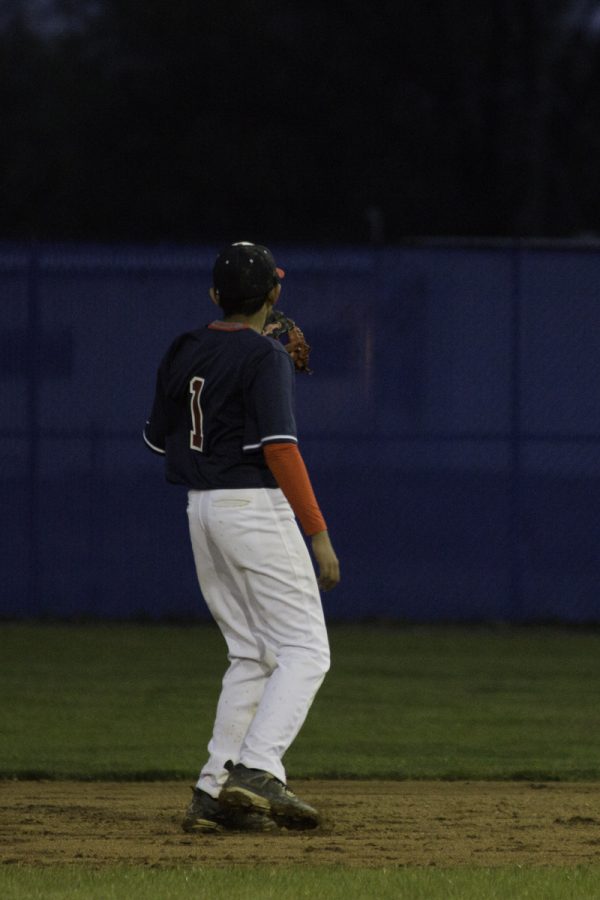 Sophomore Karthik Balakrishnan practices catching on the edge of the field.