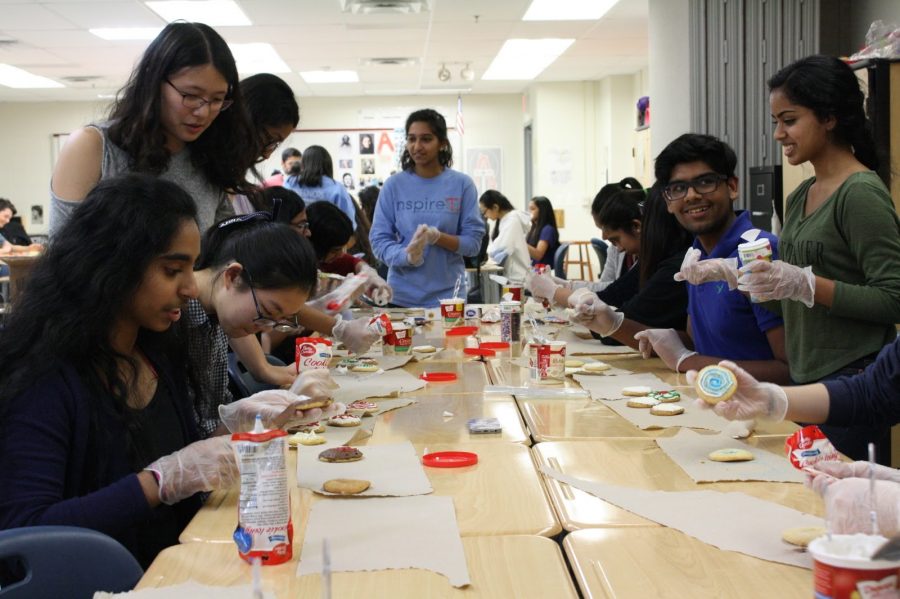 Members of the National Honor Society decorate cookies to send to the Annandale Volunteer Fire Department. The event took place on March 29 during eighth period.