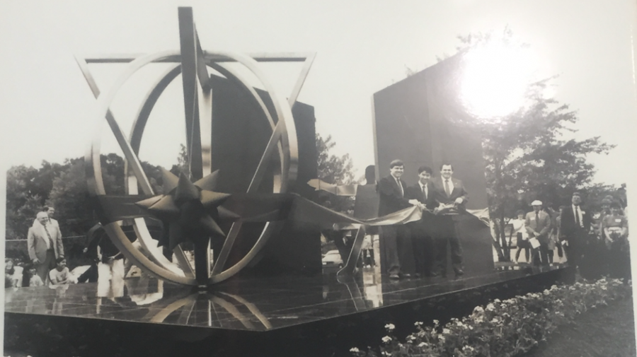 A photo of a photo in Jefferson’s display case. The photo is of the ribbon cutting ceremony held at the first unveiling of Thomas Jefferson High School.