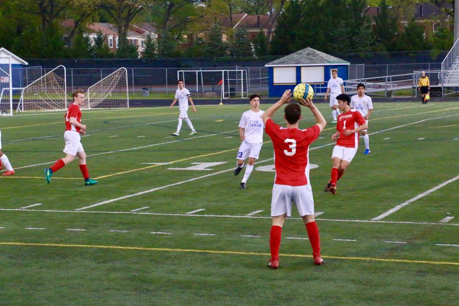 Senior Jake Nash completes a throw-in during Jeffersons varsity soccer game against Lee High School.