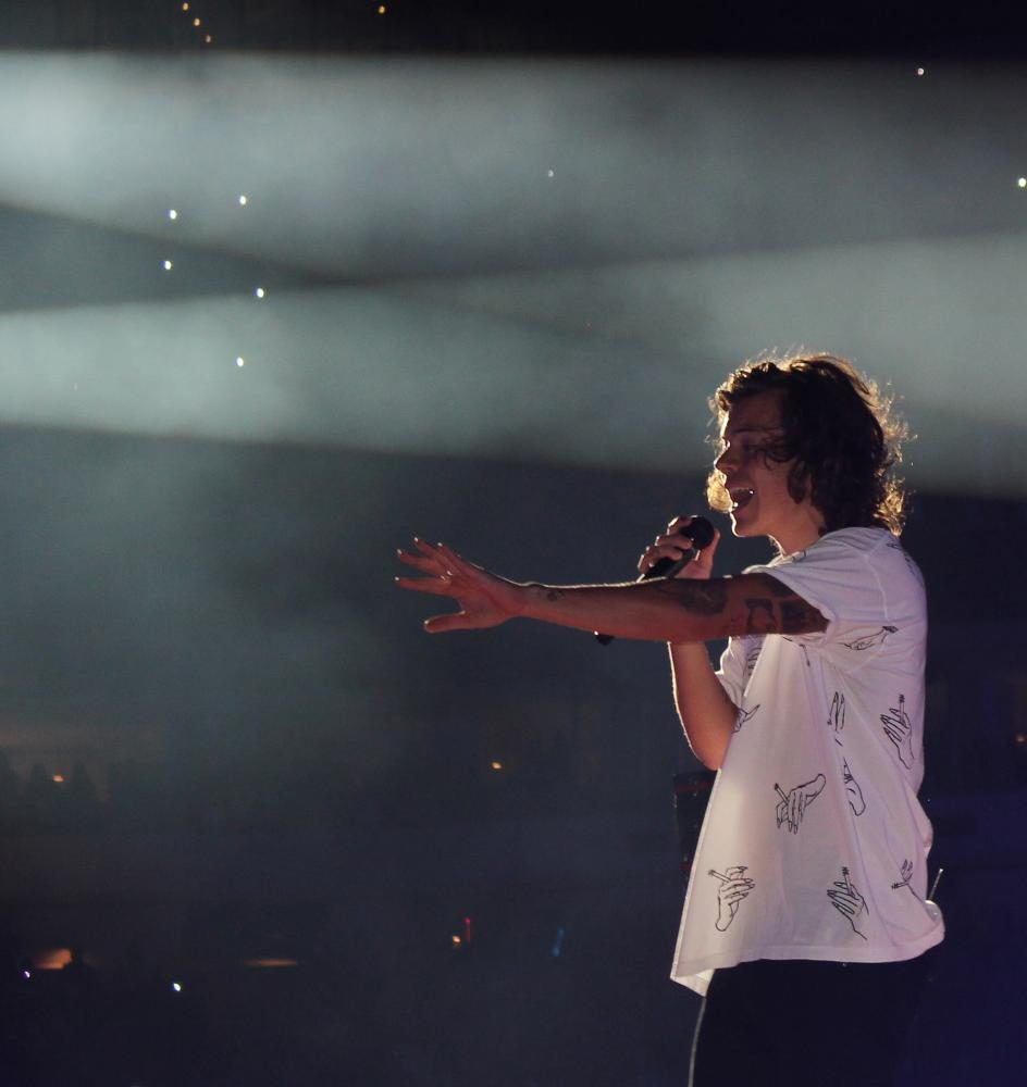 Harry Styles performing with One Direction.