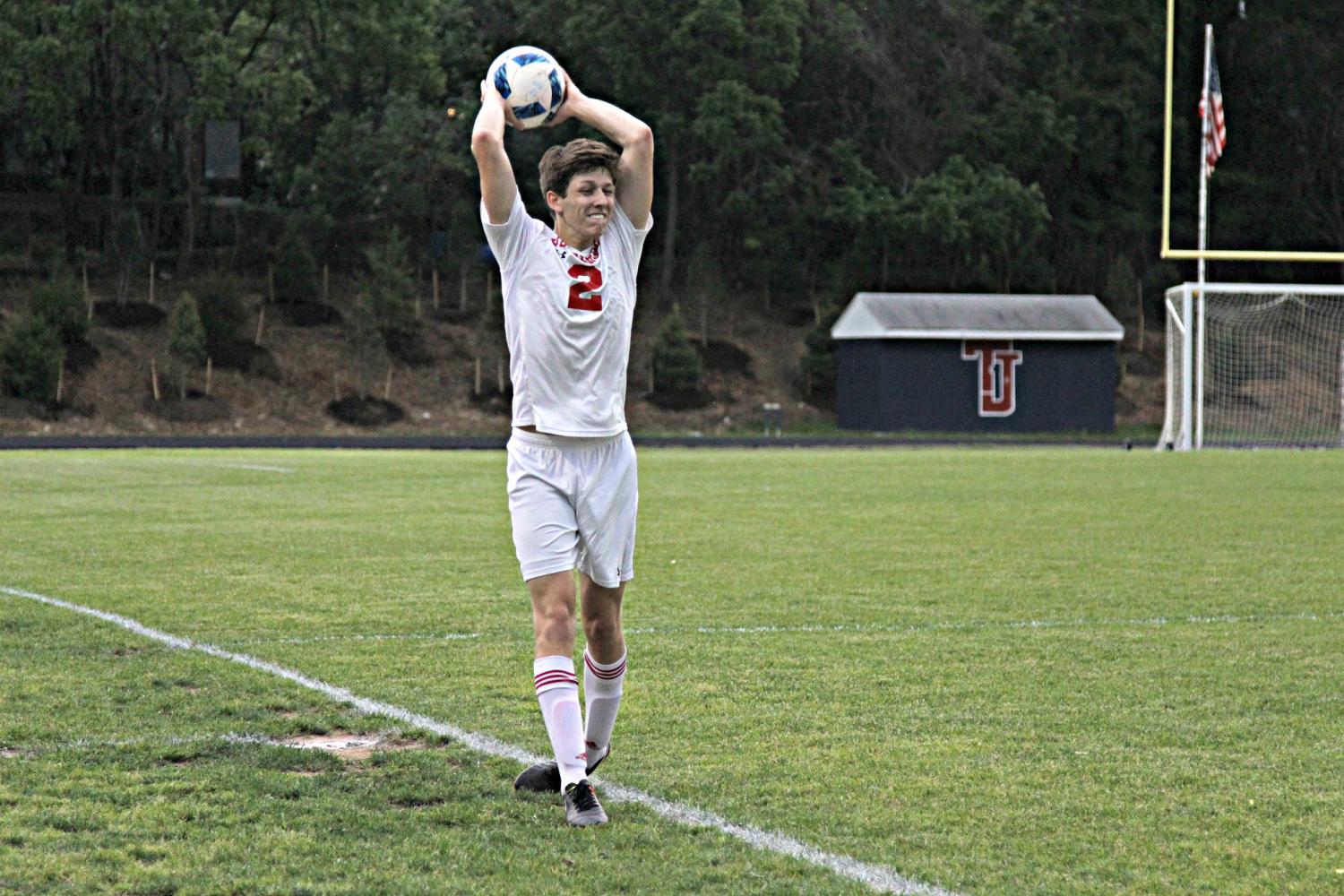 Senior Reilly McLauren throws the ball back into play.