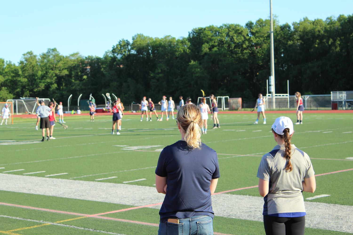 Jefferson Coaches (from left) Jacqueline Belker and Lauren Alam look on as a game progresses.