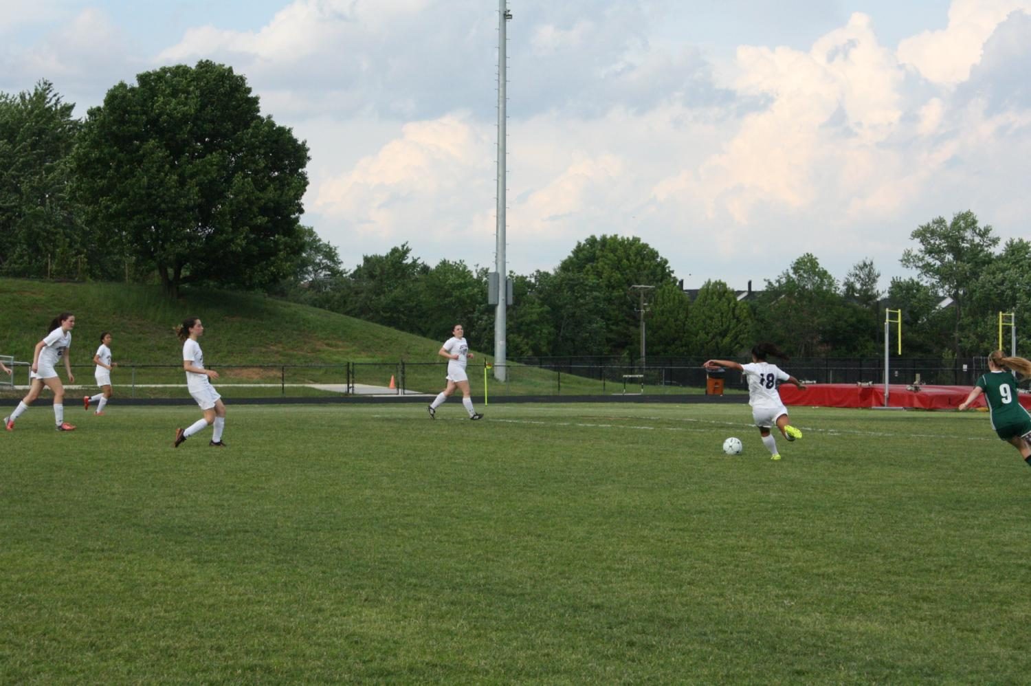 Colonials player junior My-Linh Budzien winds up to kick the ball towards a teammate.