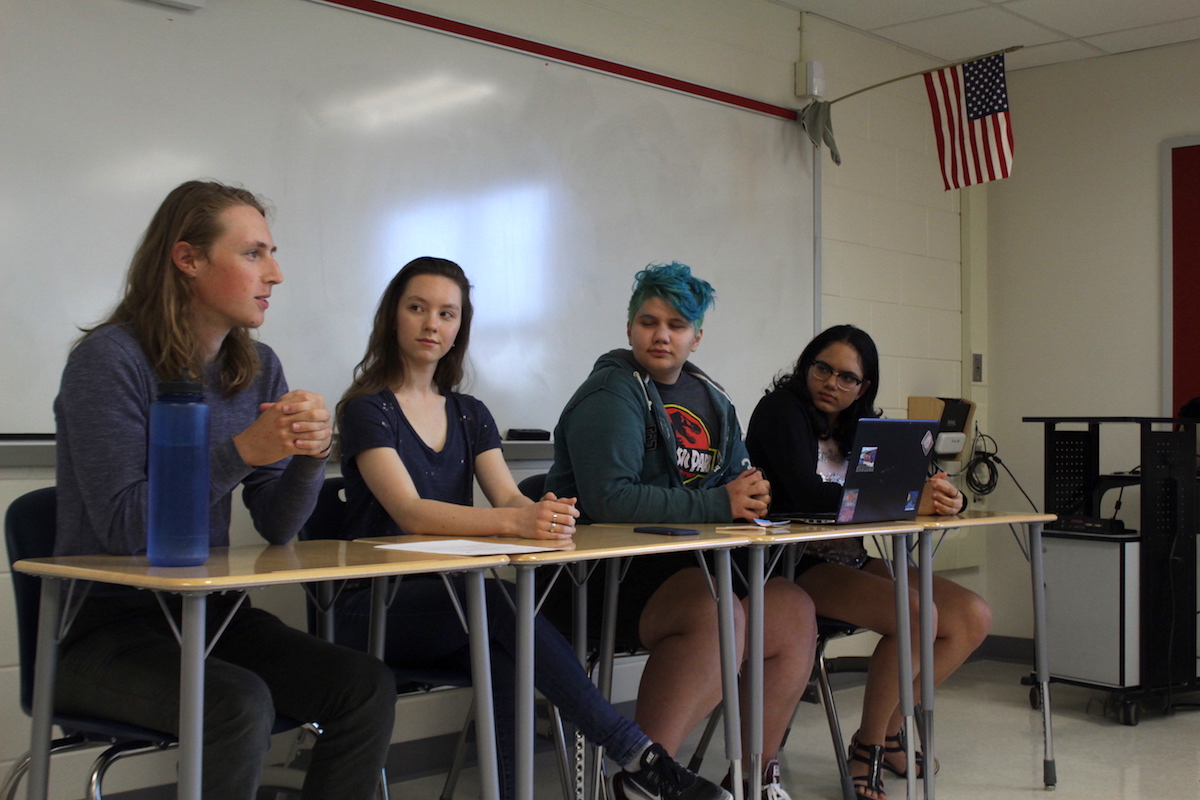 From left to right, senior Sam Libberton, senior Sofiya, junior Ash Rozzi and senior Shraddha Pradeep hold the panel during A-block.