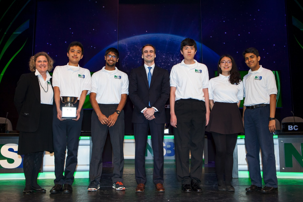 Science Bowl coach Laura McConnaughey, and members Franklyn Wang, Neeraj Prasad, Charles Wang, Joyce Tian and Aaditya Singh receives the 2nd place prize with Michael Kratsios, Deputy Assistant to the President and Deputy U.S. Chief Technology Officer in D.C..