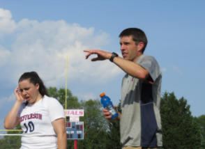 Coach Brian Collins instructs players on the game plan