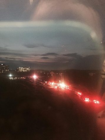 A line of fire and emergency trucks respond to an accident in Tysons Corner, as viewed from the Metro, on Aug. 22.