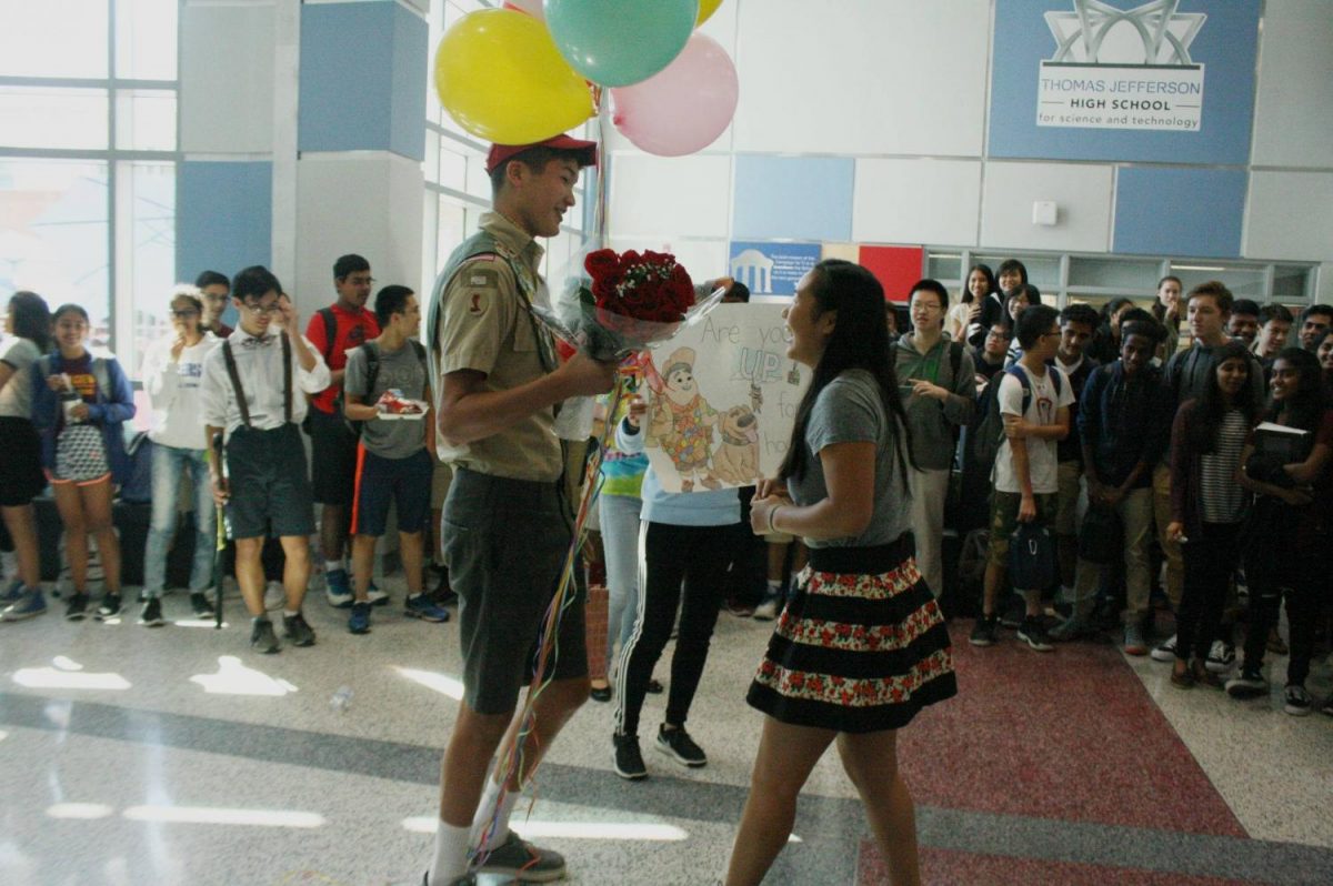 Senior Vincent Carter asks senior Lilly Ko to homecoming in the Nobel Commons.