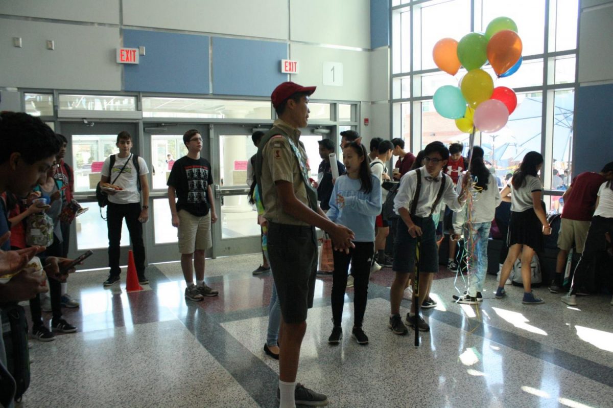 From left to right: Seniors Vincent Carter, Katie Zhang, and Nathan Stroh dress up as characters from Up for Carters asking.