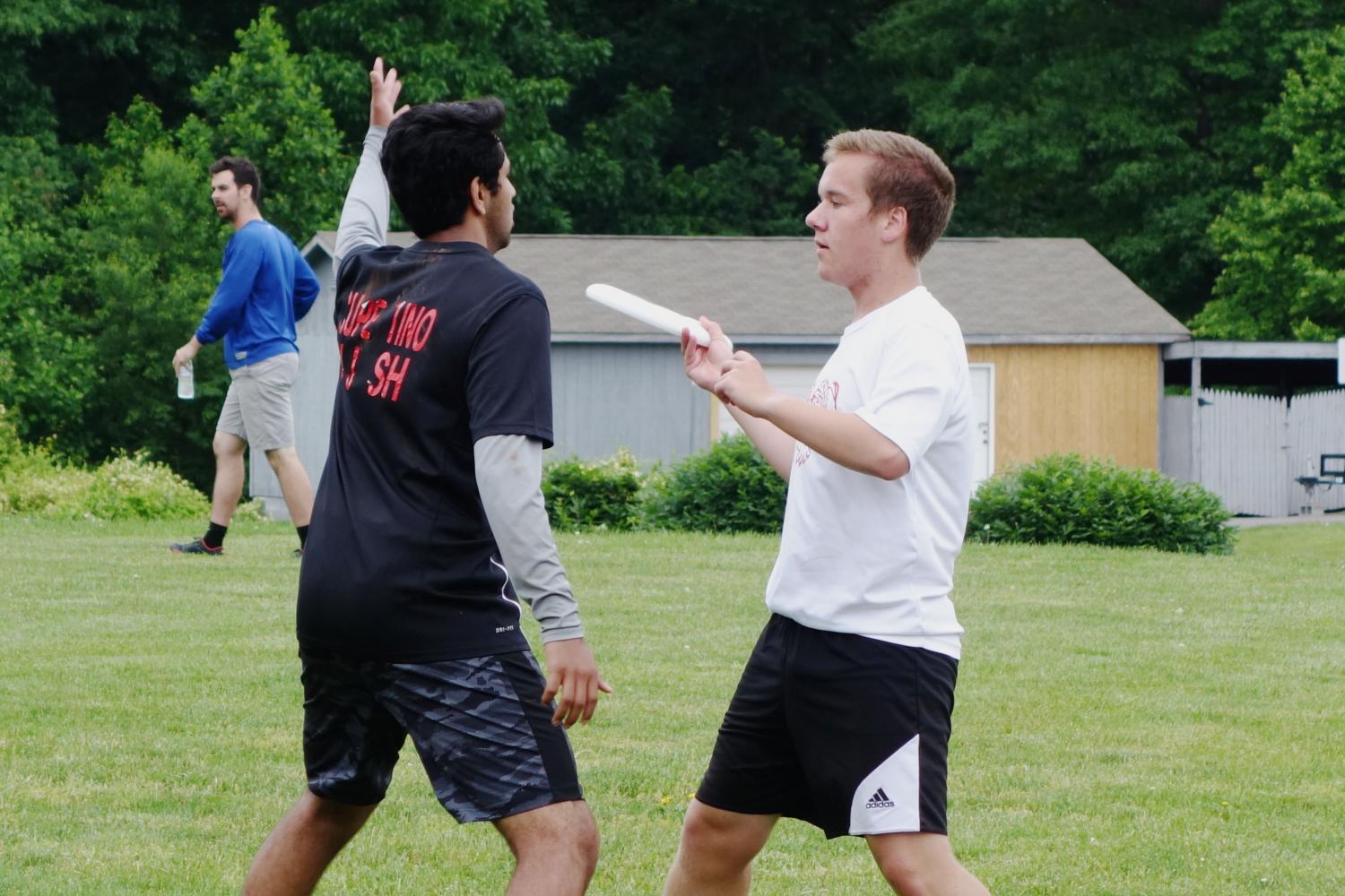 Senior Michael Krause passes the frisbee to a teammate during an Ultimate Frisbee game.  The team practices twice a week during its fall season and three to four times a week during its spring season in preparation for weekly games, weekend tournaments and the Virginia State Ultimate Tournament in the spring.  