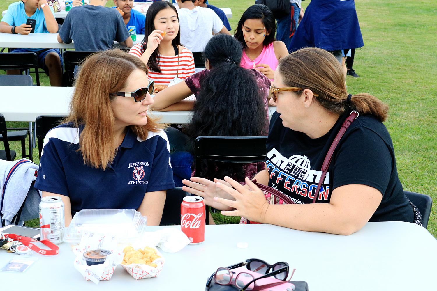 From left to right: Teachers Denise Castaldo and Marianne Razzino chat alongside other teachers and students.