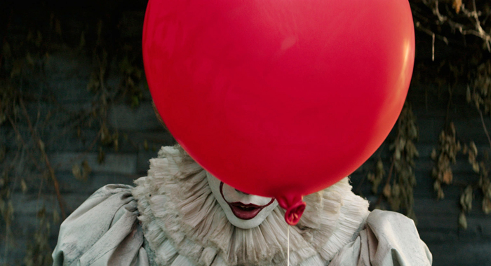 Photo+courtesy+of+Warner+Bros.+Pictures.+Pennywise+the+Dancing+Clown+hides+his+face+behind+a+red+balloon+before+confronting+one+of+his+victims.