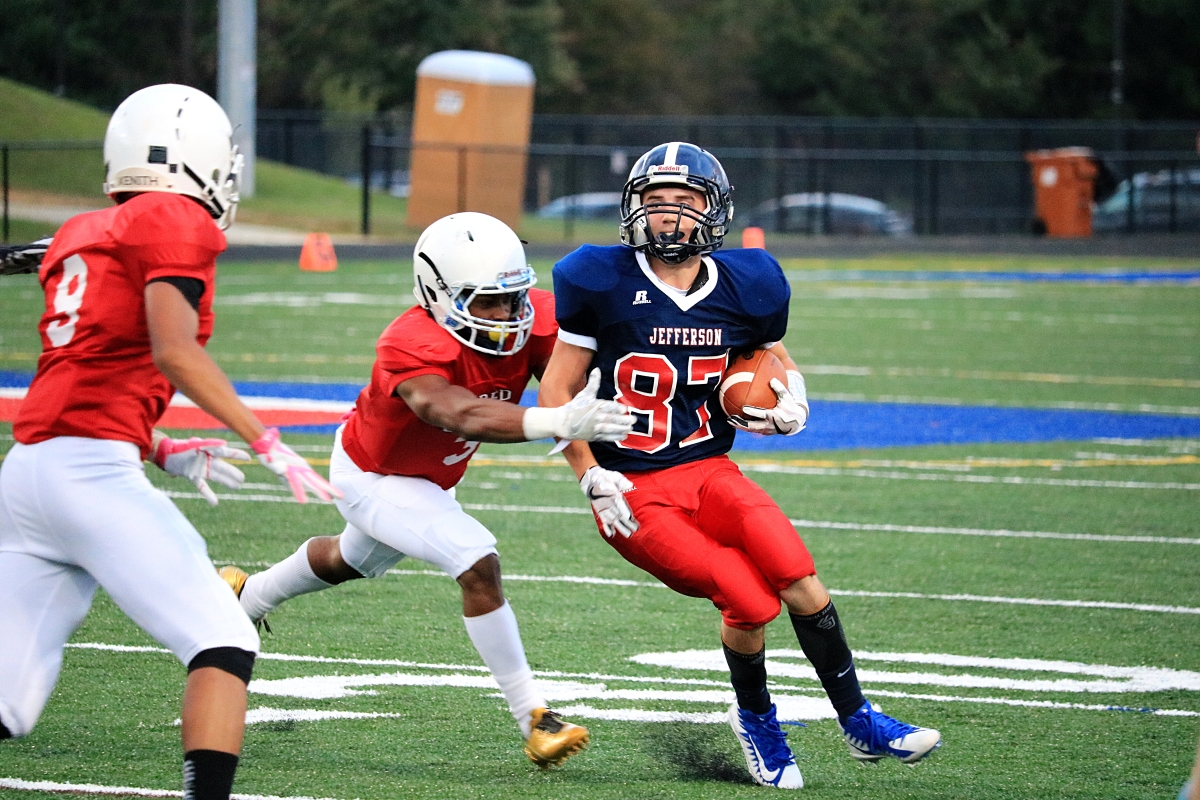 Senior Kyle Gerner dashes with the football early in the game.