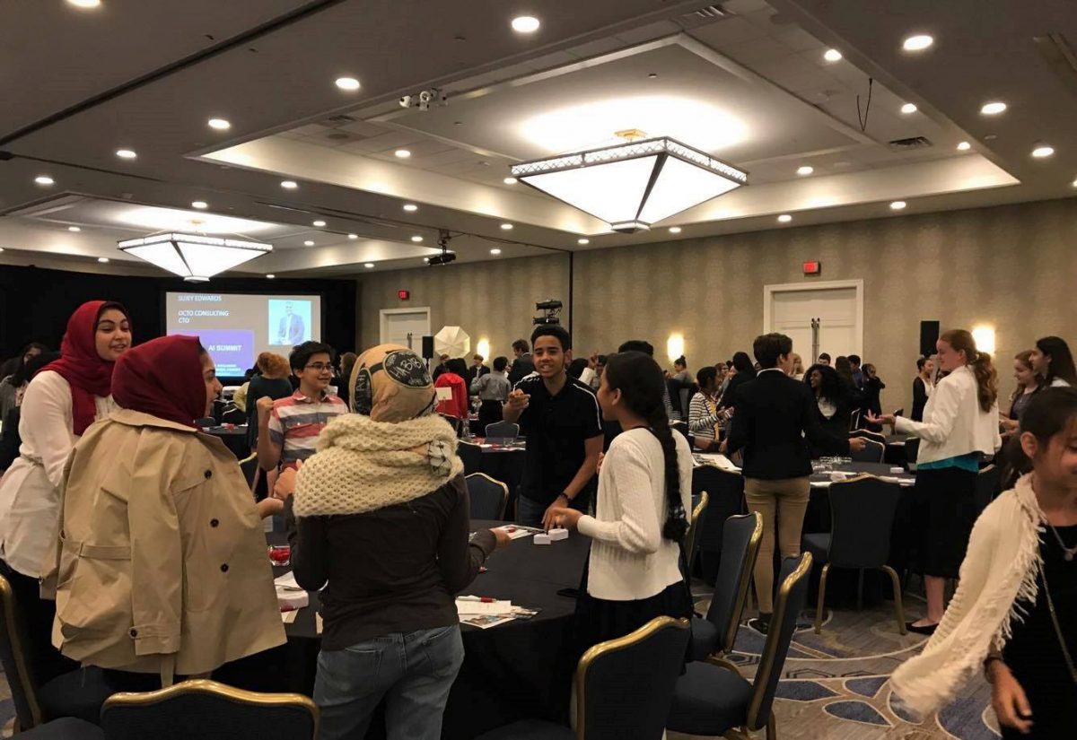 Students play a game as Chief Technology Officer of Octo Consulting Sujey Edward instructs them on what to do as part of his presentation.