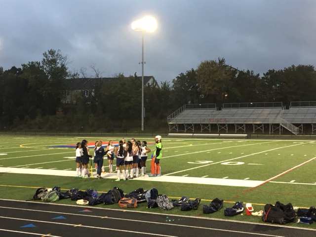 Jeffersons Junior Varsity team discusses tactics before the second half of the game.