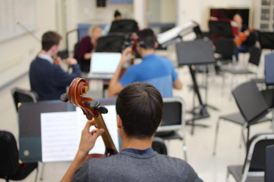 Orchestra students practicing. INSERT NAMES. The TJ Orchestra room hosts open practice sessions during 8th period