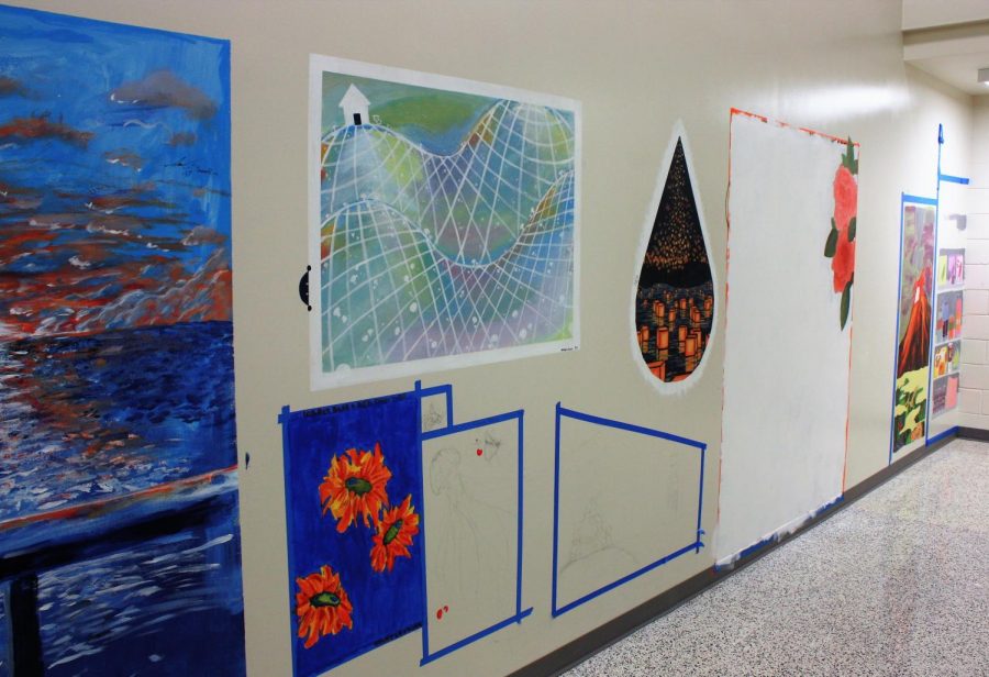 Murals painted by members of Art Honor Society in the stairwell across from the art gallery.