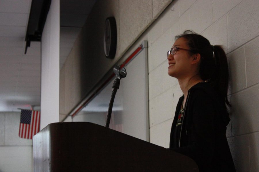 President and founder of Jefferson Poets, senior Olivia Johann, looks out from behind the podium into the crowd of students waiting in anticipation for the first 2018 Poetry Slam Contest to begin.