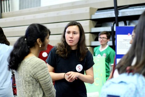 Senior, Rachel Naidich discusses her club, Coding Lady Colonials, with newcomers.
