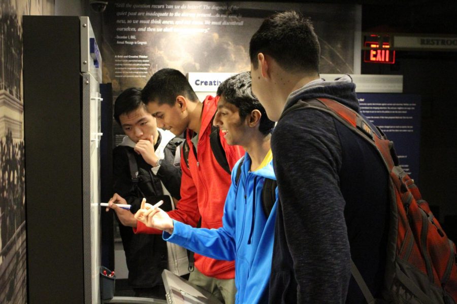 While touring the museum in the historic Peterson’s house, juniors Oscar Su, Praveen Balakrishnan, Aneesh Boreda, and Daniel Carr stop to write thoughtful responses on an interactive whiteboard asking them what equality meant to them. 
