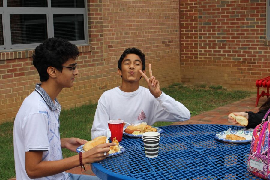 Students eat traditional German foods while socializing with friends