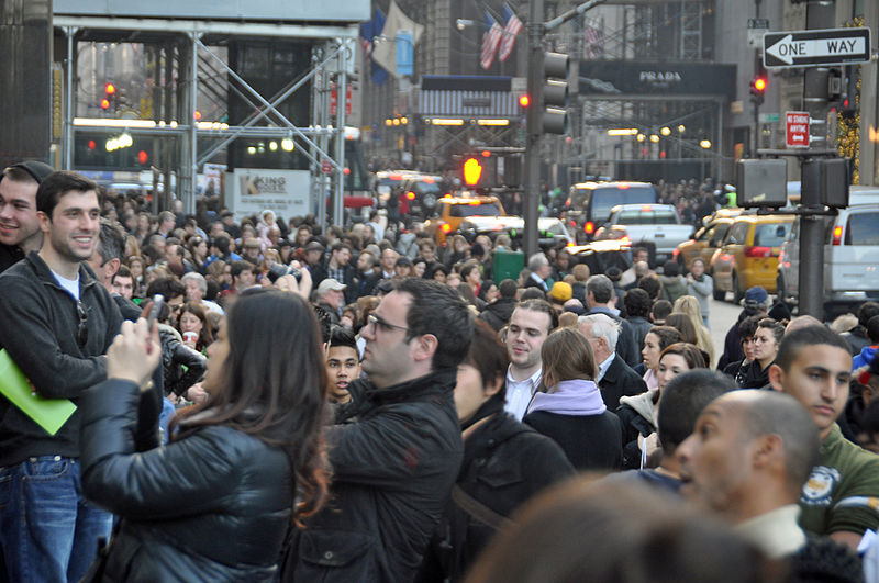 Customers gather early in the morning in front of the Apple store on Black Friday hoping to get some good deals.