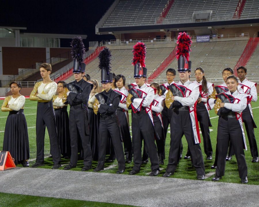 Decked out in their full performance uniforms, members of the Thomas Jefferson Marching Colonials pose at a competition. The group went on the road and brought their show in front of judges at Liberty University on Nov. 3. They did a total of five competitions this year and performed at the home football games.