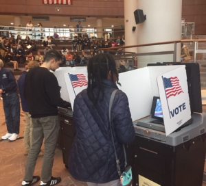 During training, pages have the opportunity to take a voting machine on a test run with a pretend election for the mayor of Mount Rushmore.