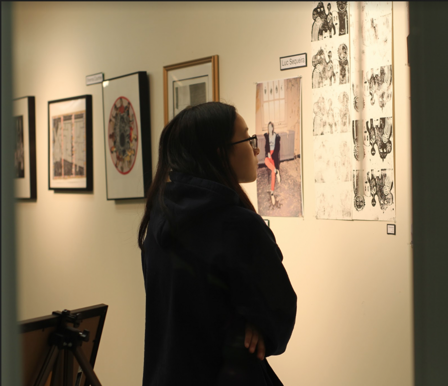 Junior Sophie Uy admiring a block print piece at the Gala