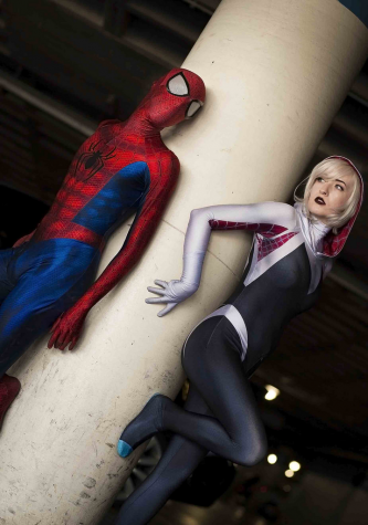 Spider-Man and Spider-Gwen, also known as Spider-Woman, stand side by side ready to take on the world, bringing about diversity as a woman behind the mask. 