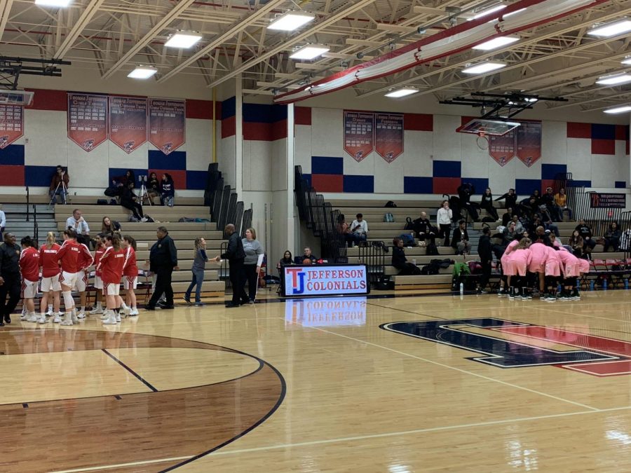 Jefferson and Wakefield strategize during after warm-ups. during a Friday night game at TJ, the Jefferson Girls Varsity Basketball team played Wakefield. 