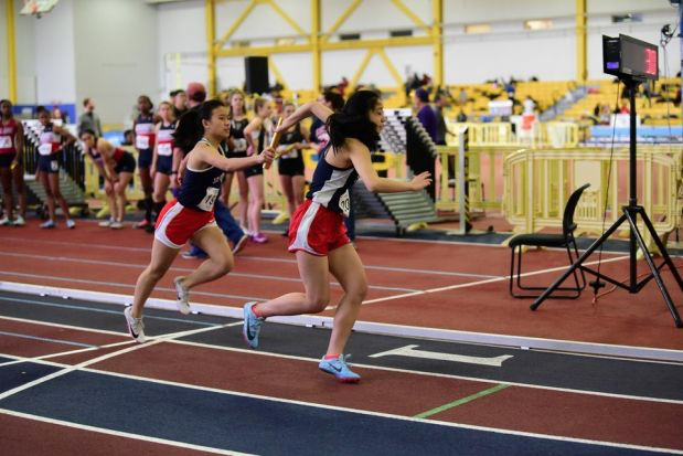 Sophomore Tammy Ding and junior Mia Yang compete in a relay at VHSL Region 5C Indoor Championships. Whether indoor or not, Ding finds track to be a blessing. “It’s so easy to get caught up in small matters—which can easily ruin your day—but I find that track helps me relax and detoxify,” Ding said.