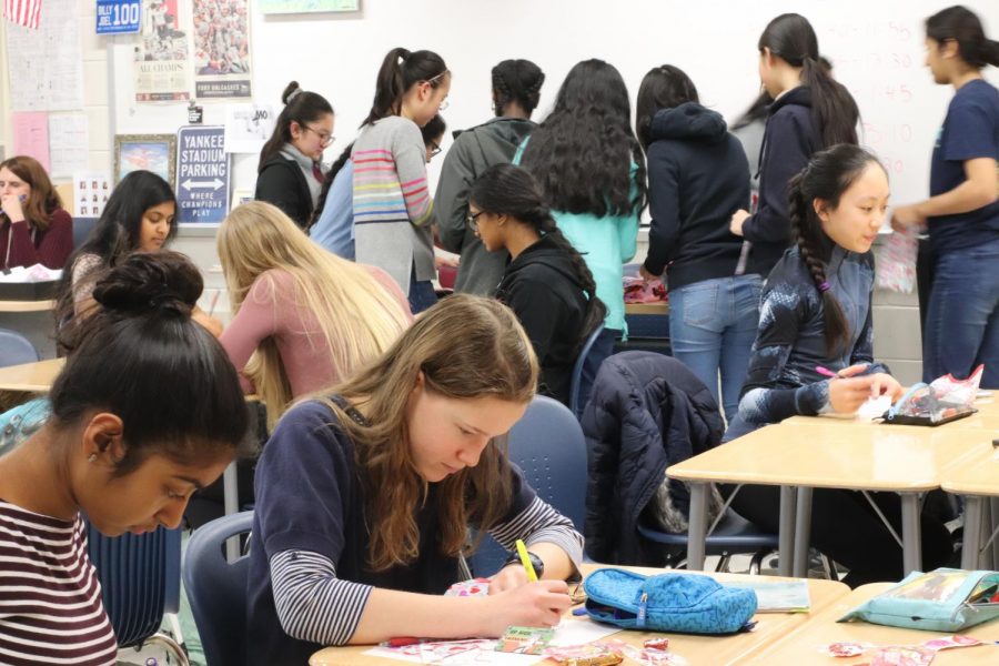 Freshmen Aafreen Ali and Rachel Lewis write notes and make goody bags in the Valentine’s Day Service Activity hosted by Jefferson’s UNICEF chapter. This event was hosted to help support UNICEF’s monthly goal and INOVA’s Children’s Hospital.