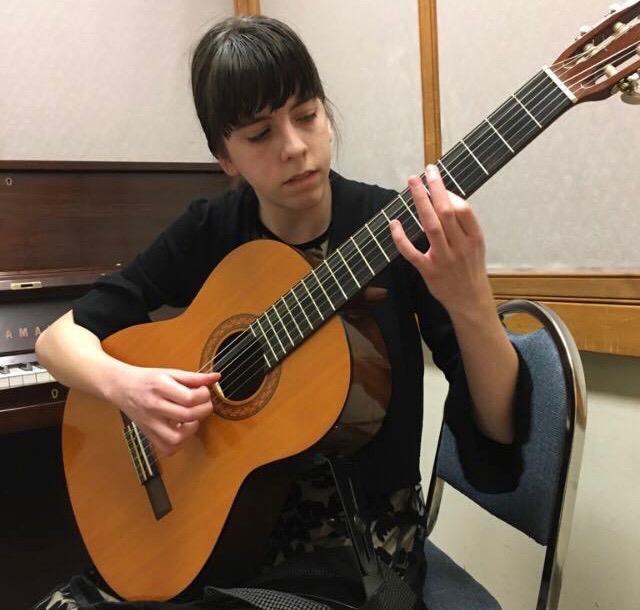 Freshman Elizabeth Brown avidly practices classical guitar. Many students at Jefferson have been involved with musical instruments, and guitar is no exception.