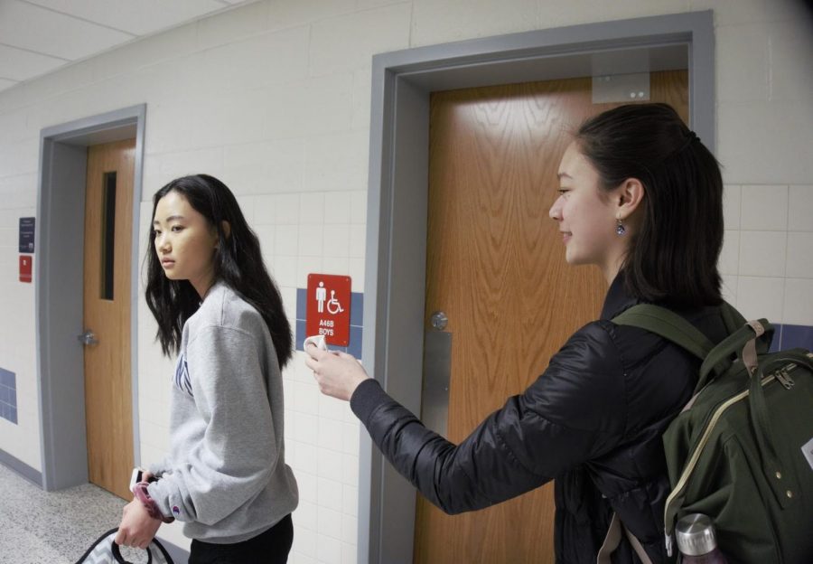 Sneaking up behind freshman Jeanie Qi, freshman Alyssa Rask attempts to "kill" her with a sock in the hallways during lunch.