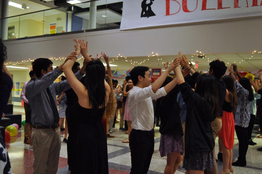 The members in SHS do a step in the dance where girl puts her hands up and the guy spins her around.