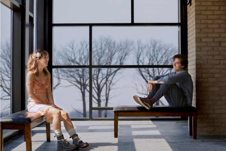 Stella (Haley Lu Richardson) and Will (Cole Sprouse) sitting in the hospital ward together. In order to not catch each other's bacteria, they must remain six feet apart at all times. 