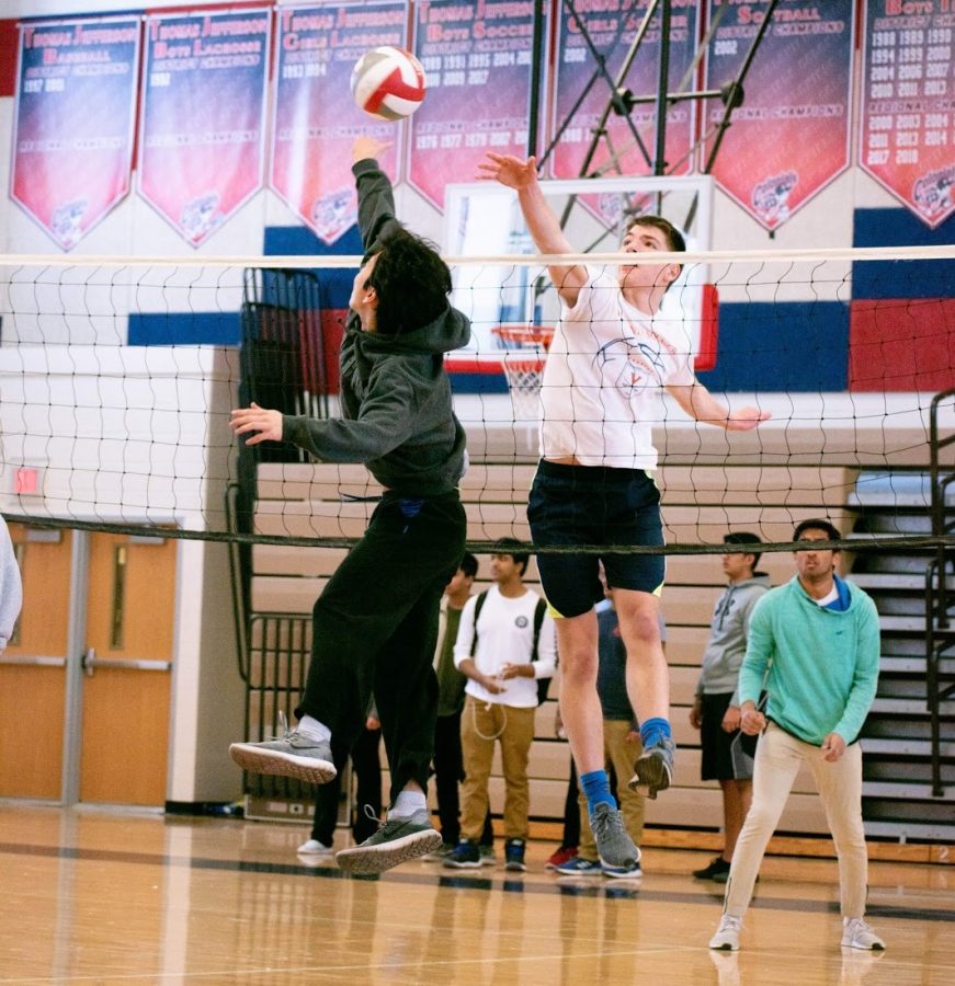 William Yao leaps up to return a serve during a high-intensity match of volleyball.