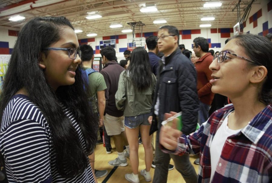 Freshmen Lily Walters talks about IBET and course selections to Ananya Banderu, a rising freshman at Jefferson during welcome night.